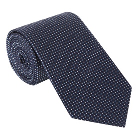 Navy silk tie with tonal micro-dot pattern, rolled and displayed flat against a white background