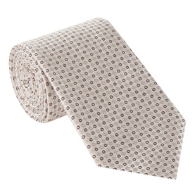 Cream silk tie with small repeating geometric floral print in grey, rolled to show texture and width