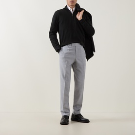 Model wearing Hugo Boss open grey slim-fit trousers in wool-linen blend, styled with black half-zip jumper and black leather shoes