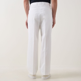 Model wearing Hugo Boss open white cotton trousers, straight-leg fit with belt loops, shown from rear view, styled with navy top.