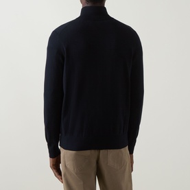 Model wearing Hugo Boss Orange dark blue cotton-cashmere zip-through knit, rear view, styled with beige trousers.