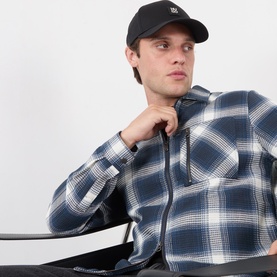 Model with Hugo Jake-ME Stacked Logo Baseball Cap in black, worn with navy plaid checked shirt with zip detail.