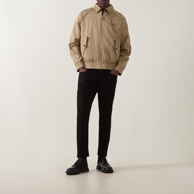 Model wearing Hugo medium beige casual jacket with black trousers and black leather shoes.