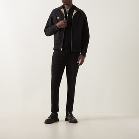 Model wearing Hugo Casual Jacket in medium beige with black trousers and black leather shoes.