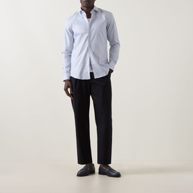 Model wearing Hugo Kenno Stripe Shirt in Open Blue with black tapered trousers and black loafers.