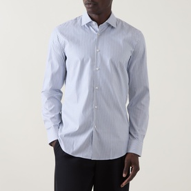 Model wearing Hugo Kenno Stripe Shirt in Open Blue, long-sleeve striped cotton shirt with cut-away collar, styled with black trousers