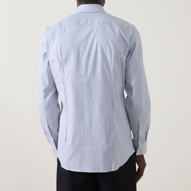 Model wearing Hugo Kenno Stripe Shirt in Open Blue, rear view showing stripe pattern, long sleeves, single cuff, and curved hemline.