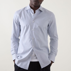 Model wearing Hugo Kenno Stripe Shirt in Open Blue, featuring cut-away collar, long sleeves and single cuff, styled with black trousers