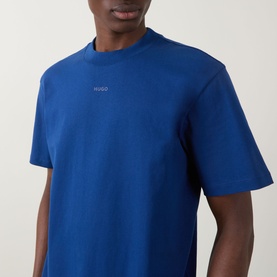 Model wearing Hugo Dapolino Logo T-Shirt in Open Blue, crew neck cotton tee with small chest logo detail, short sleeves