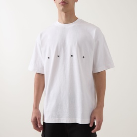 Model wearing Hugo Crew Neck T in natural white cotton, with small logo lettering across the chest, relaxed fit