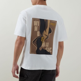Model wearing Hugo Detzi Logo T-Shirt in Natural white, showing back graphic Wine & Music print, with black trousers