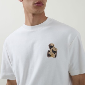 Model wearing Hugo Detzi Logo T-Shirt in Natural white, featuring a small sculptural graphic logo print on the chest, crew neck, short sleeves.