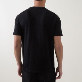 Model wearing Hugo black crew neck T-shirt, rear view, short sleeves, relaxed fit in 100% cotton