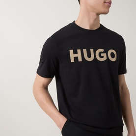Model wearing Hugo black cotton crew neck T-shirt with large contrast logo print to chest