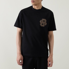 Model wearing Hugo black cotton crew neck T-shirt with striped logo graphic print on chest