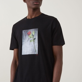 Model wearing Hugo Durose Graphic T-Shirt in black with rose photo graphic print on chest, crew neck, short sleeves