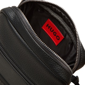 Hugo Ethon 2.0 Crossbody Bag in black pebble-textured finish, open to reveal red logo interior label and silver-tone zip hardware