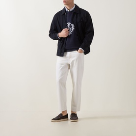 Model wearing Hugo 3049 Jeans in Natural white, styled with navy jacket, knit and dark espadrilles