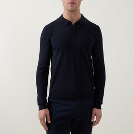 Model wearing Hugo navy long-sleeve knit polo shirt with open collar, styled with navy trousers.