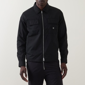 Model wearing Hugo black polyester overshirt with zip fastening, chest patch pockets and logo badge detail