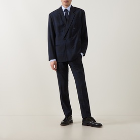 Model wearing Hugo Hogan263X Tonal Check Suit Trousers in dark blue, styled with matching double-breasted blazer, light blue shirt and black shoes