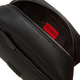 Hugo Ethon 2.0 Wash Bag in black pebble-textured faux leather, open top zip showing red logo badge interior, silver-tone hardware