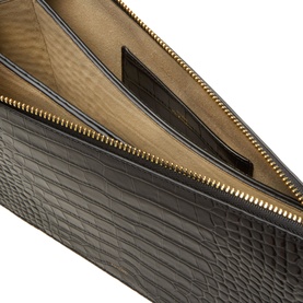 Toteme Threefold Croco-Embossed Clutch in black, open view showing tan lining, gold-tone zip hardware and croco-embossed leather exterior