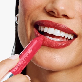 Model wearing Clinique Chubby Stick Moisturizing Lip Colour Balm in Chunky Cherry, a bold red-pink shade