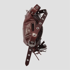 Maje dark burgundy leather belt bag with silver eyelet detailing, buckle strap, and black fringe trim accent.