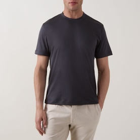 Model wearing Eleventy Girocollo Solid T-Shirt in black, crew neck, short sleeves, styled with beige trousers