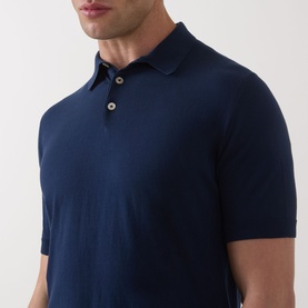 Model wearing Eleventy Iconic Polo Shirt in navy, featuring knit construction, three-button placket and polo collar, close-up view