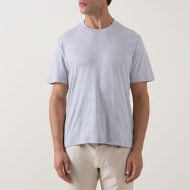 Model wearing Eleventy Girocollo Solid T-Shirt in grey, crew neck, short sleeves, soft jersey finish, styled with cream trousers.