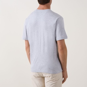 Model wearing Eleventy Girocollo Solid T-Shirt in grey, rear view, crew neck, short sleeves, straight hem, styled with stone chinos.