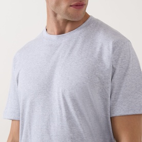 Model wearing Eleventy Girocollo Solid T-Shirt in grey, featuring crew neckline, short sleeves, and soft jersey finish.