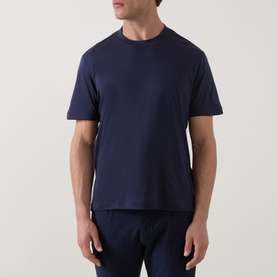 Model wearing Eleventy navy crew neck T-shirt, short sleeves, styled with navy trousers
