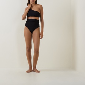 Model wearing Max Mara black one-shoulder bikini top with matching high-waist black bikini bottoms.