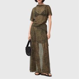 Model wearing All Saints Sali Printed Transparent Top in Sirius Gold, styled with matching skirt, black bralette, bag and sandals.