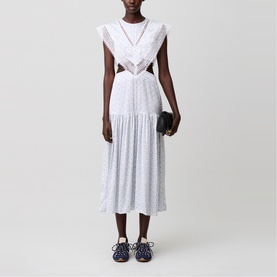 Model wearing Claude Pierlot Womens French Dress in light print, featuring lace trim, cut-out waist, and tiered midi skirt, styled with navy loafers