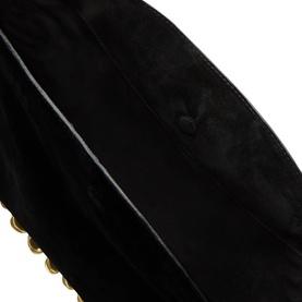 Isabel Marant Oskan Medallion Suede Hobo Bag in black, close-up showing suede texture and gold-tone scalloped hardware detail along base edge.