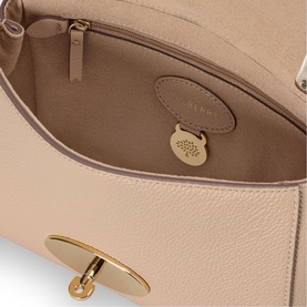 Mulberry Lily Small Crossbody Bag in Crumpet leather, interior view showing slip pocket, gold-tone fob with padlock detail and postman's lock closure.