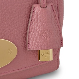 Mulberry Lily Small Crossbody Bag in Pink Scrumpy leather, close-up of postman's lock closure and hanging fob with soft gold-tone hardware