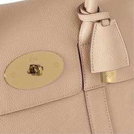 Mulberry Bayswater Small Top Handle Bag in Crumpet leather, close-up of postman's lock closure and hanging leather fob with soft gold-tone hardware