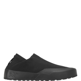Arcteryx black slip-on shoe with knitted textile upper, logo detail, and black rubber outsole. Laceless low-profile silhouette.