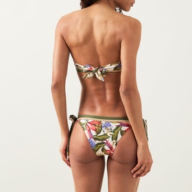 Model wearing Farm Rio Strilitzia Printed Handkerchief Bikini Top in Light Blush, botanical print, self-tie back, styled with matching bikini bottoms.