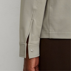 Reiss beige jacket cuff detail with silver press-stud fastening and side split, styled with dark trousers