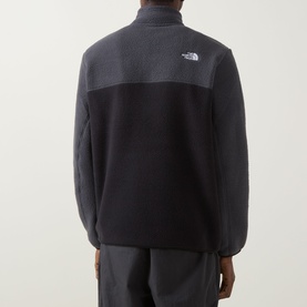 Model wearing North Face Yumiori Half-Zip Sweatshirt in Black/Grey fleece, rear view showing colour-block design and embroidered logo