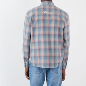 Model wearing Pleasures pink plaid cotton casual shirt, back view with embroidered logo, styled with light blue jeans