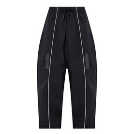 Pleasures black nylon casual trousers with white contrast piping, drawstring waist, and logo lettering on leg