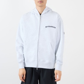 Model wearing Pleasures grey zip-up cotton hoodie with embroidered logo on chest and small sleeve badge detail