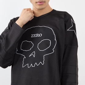 Model wearing Pleasures Jamie Hockey Jersey in black mesh with white skull and ZERO graphic print, long sleeves with star detailing